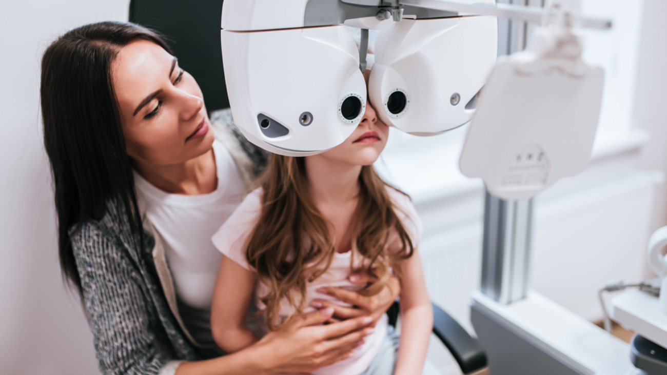 Mom with daughter in ophthalmology clinic