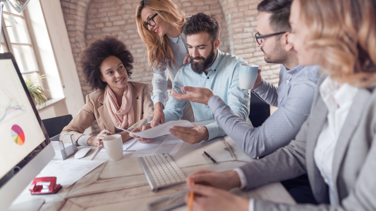 Business people in office holding a conference and discussing strategies.