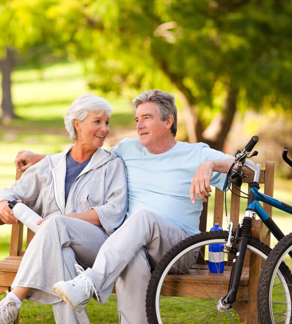 Elderly couple in park after a bike ride -Take Charge of Your Health