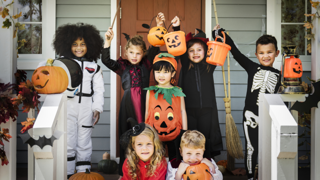 Little children in Halloween costumes representing halloween costume safety