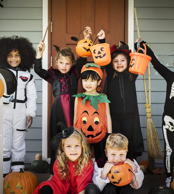 Little children in Halloween costumes representing halloween costume safety