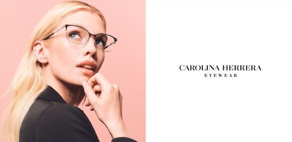Blonde professional woman showcasing new eyeglass frames from Carolina Herrera Eyewear.