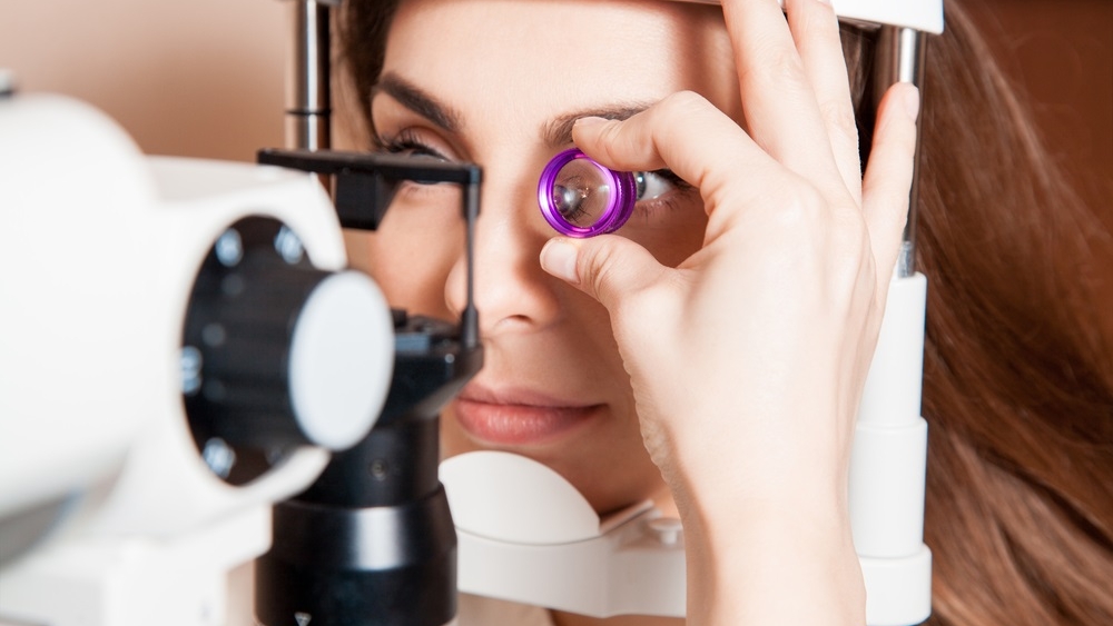 a-woman-getting-her-vision-checked-at-a-optomotrists office.