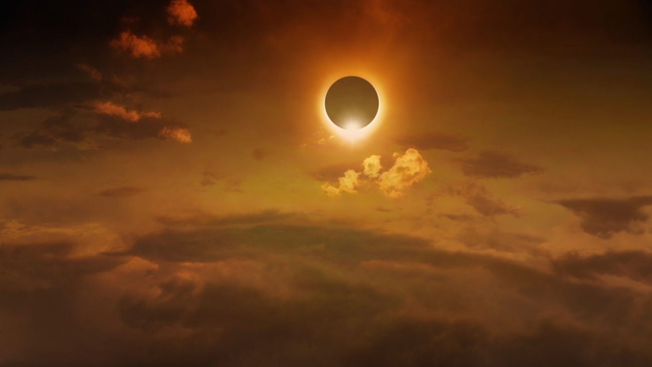Eye-Safe Skywatching Amazing scientific background - total solar eclipse in dark red glowing sky, mysterious natural phenomenon when Moon passes between planet Earth and Sun