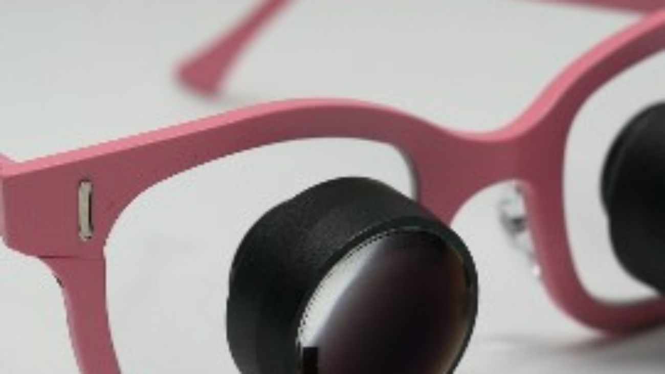 pink glasses with attached black rings that are ioptic telescopic glasses