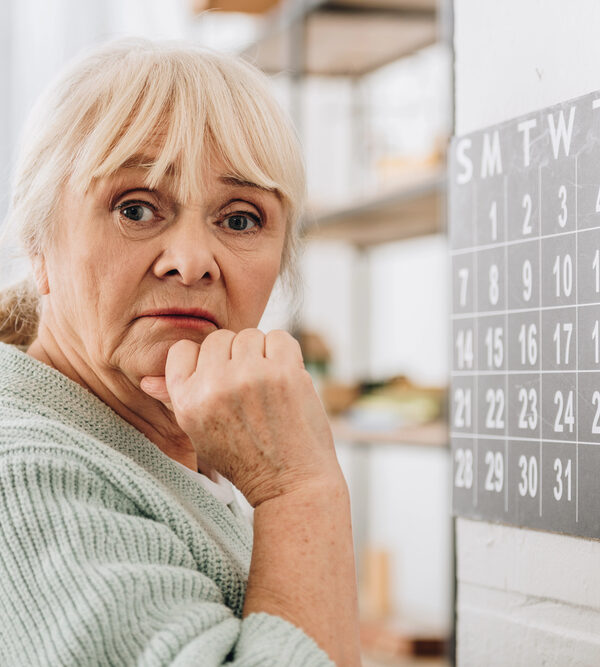 image of a senior age woman with her chin in her hand representing Low Vision After a Stroke