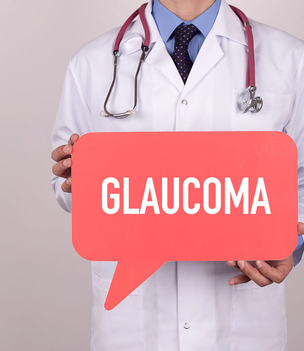 glaucoma symptoms treatment and prevention - ye doctor holding sign that says Glaucoma