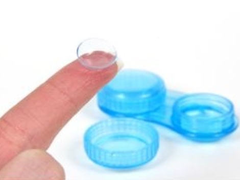 contact lens case with contact lens on finger